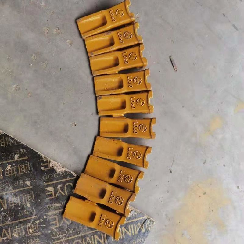 Adaptador de dientes para excavadoras y placa de cuchilla mejor precio y dientes duros para cubos