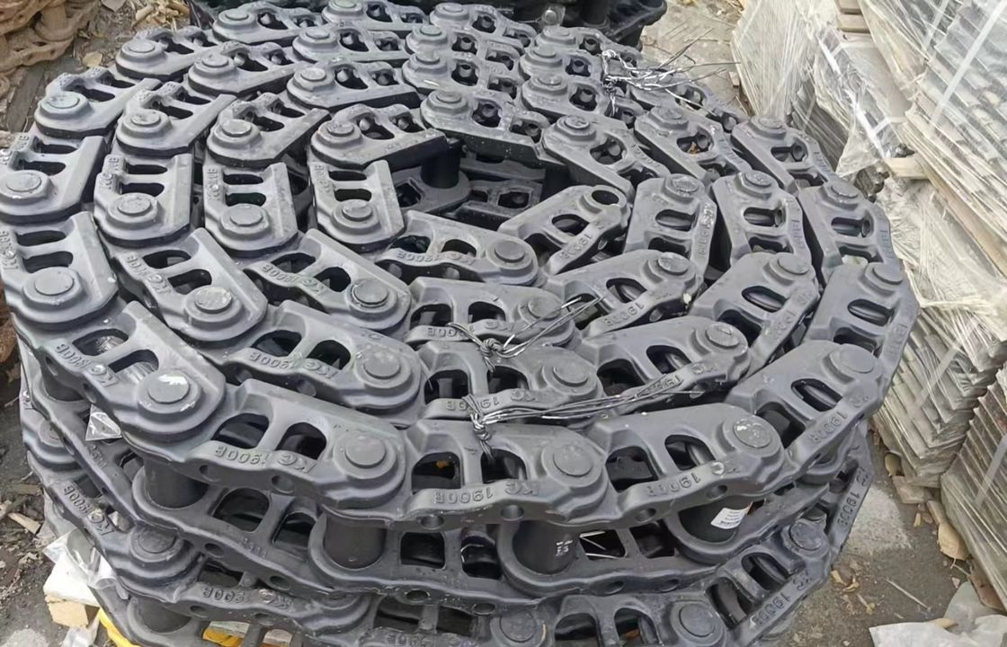 Sk200 piezas de excavadora debajo del chasis piezas de pista de enlace de pista de zapatos de pista de rodillo de arriba abajo rodillo Sprokcet idler