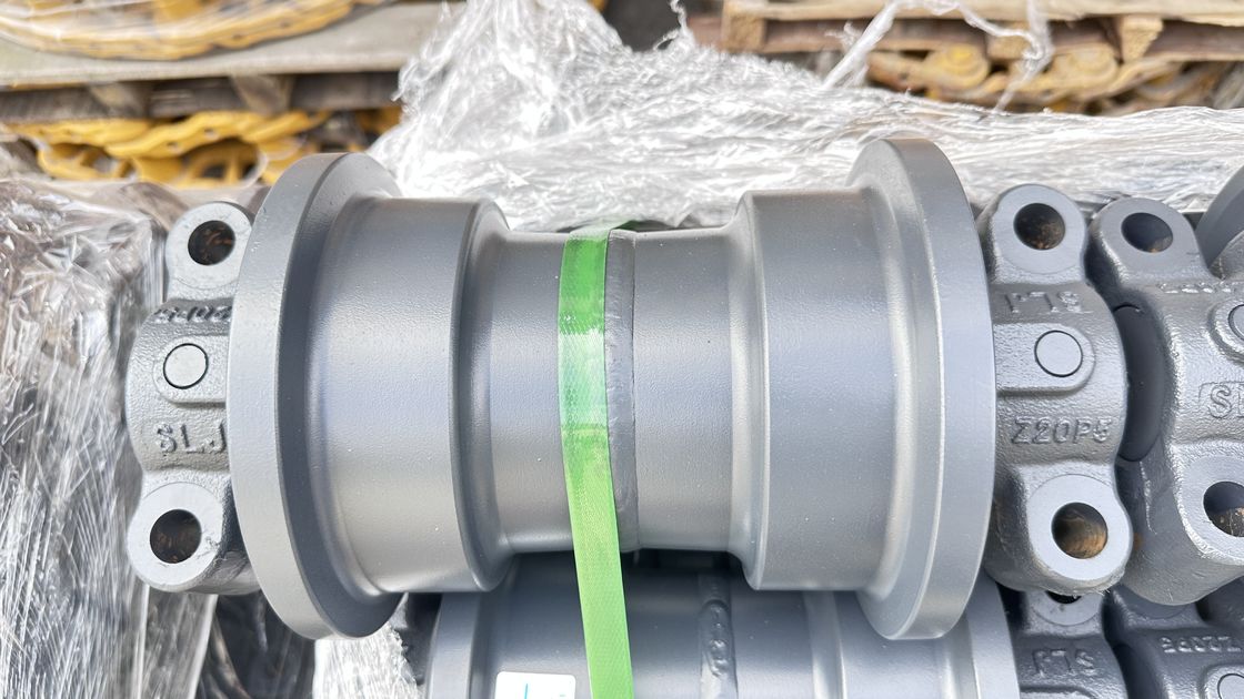 Sk200 piezas de excavadora debajo del chasis piezas de pista de enlace de pista de zapatos de pista de rodillo de arriba abajo rodillo Sprokcet idler